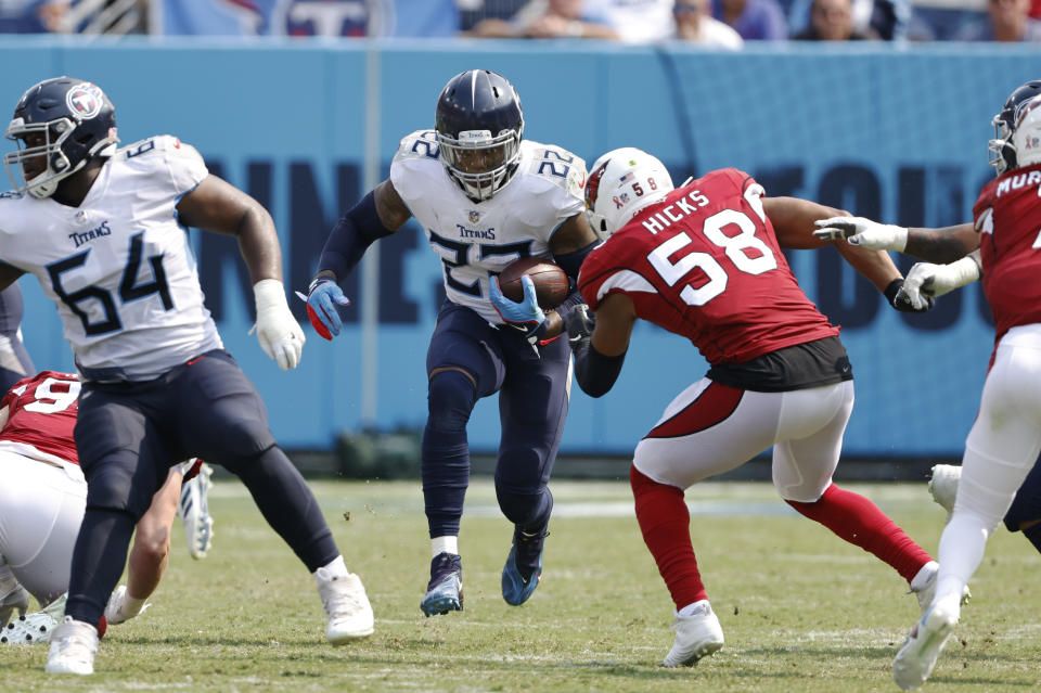 Tennessee Titans running back Derrick Henry (22) carries the ball against Arizona Cardinals middle linebacker Jordan Hicks (58) in the second half of an NFL football game Sunday, Sept. 12, 2021, in Nashville, Tenn. (AP Photo/Wade Payne)