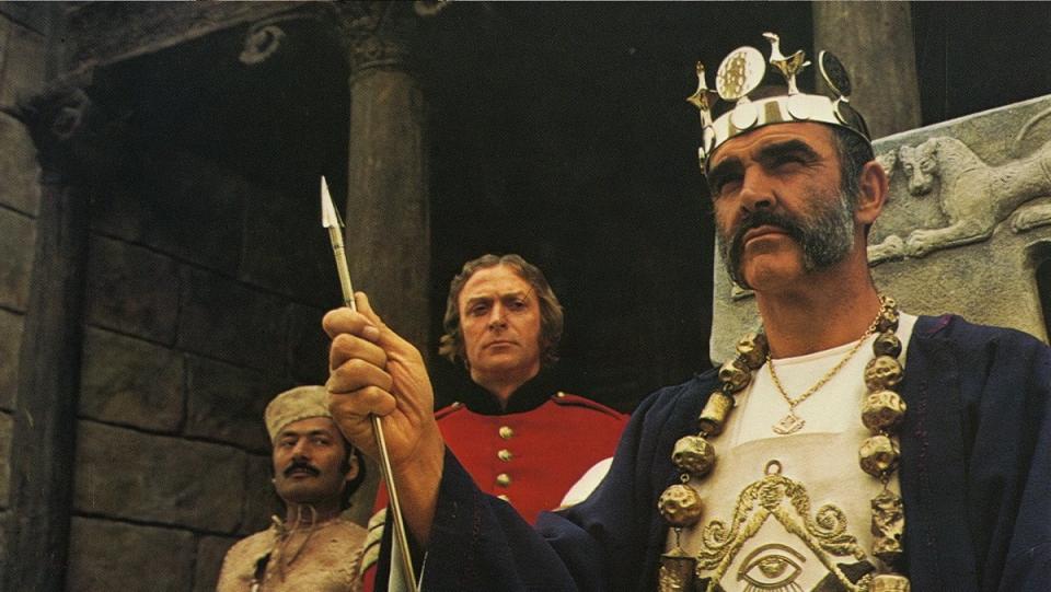 Michael Caine looks on as Sean Connery becomes a god in The Man Who Would Be King.