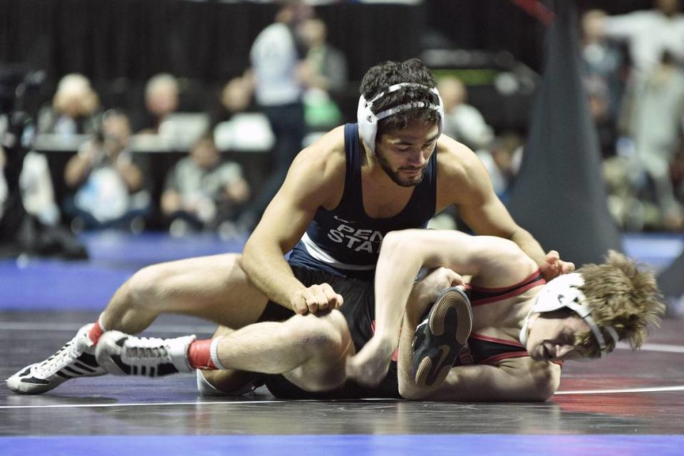 Penn State’s Shayne Van Ness tries to escape from Indiana’s Graham Rooks in their 149-pound quarterfinals match of the NCAA Championships on Friday, March 17, 2023 at the BOK Center in Tulsa, Okla. Van Ness topped Rooks, 10-7.