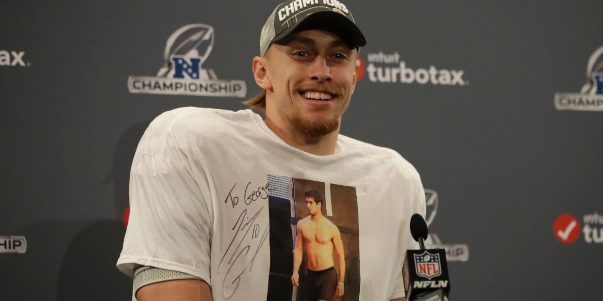 San Francisco 49ers tight end George Kittle wears a shirt showing quarterback Jimmy Garoppolo as he speaks at a news conference after the NFL NFC Championship football game against the Green Bay Packers Sunday, Jan. 19, 2020, in Santa Clara, California.