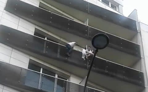 Mamoudou Gassam rescues young child from building in Paris  - Credit: Telegraph