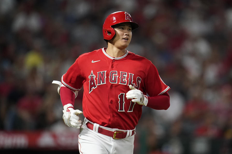 Los Angeles Angels designated hitter Shohei Ohtani (17) runs to first while flying out to right field during the sixth inning of a baseball game against the Detroit Tigers in Anaheim, Calif., Tuesday, Sept. 6, 2022. (AP Photo/Ashley Landis)