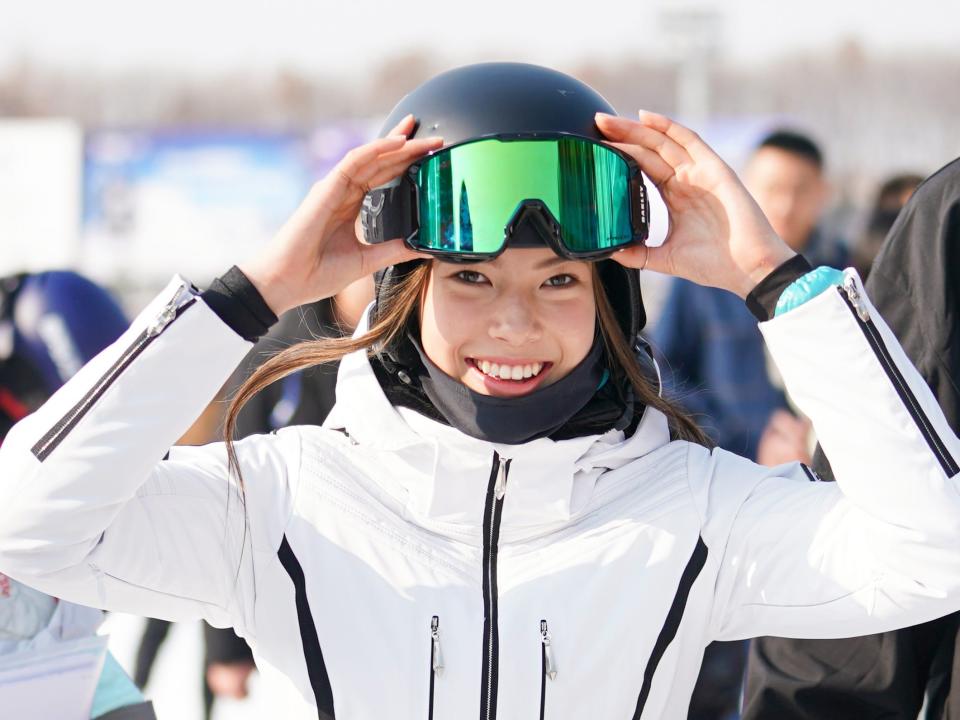 Skiier Eileen Gu poses at press conference in Beijing, China.