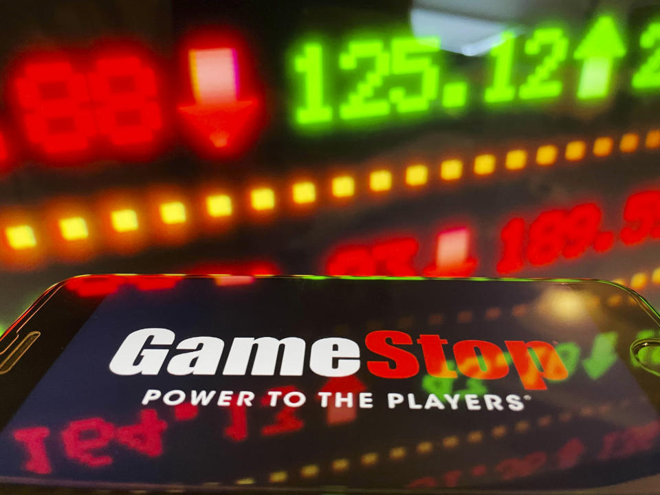 Photo by: STRF/STAR MAX/IPx 2021 1/29/21 Dow drops more than 600 points today to finish the worst week since October 2020 amidst the trading frenzy with GameStop, AMC and other stocks. Robinhood has come under intense scrutiny as it is now limiting trades on more than 50 stocks. Trading platforms such as STASH have issued statements favoring long term over short term trading. Platforms have struggled to keep up with the volume of trades being executed. STAR MAX Photo: An Gamestop logo and stock ticker symbols photographed off Apple devices.