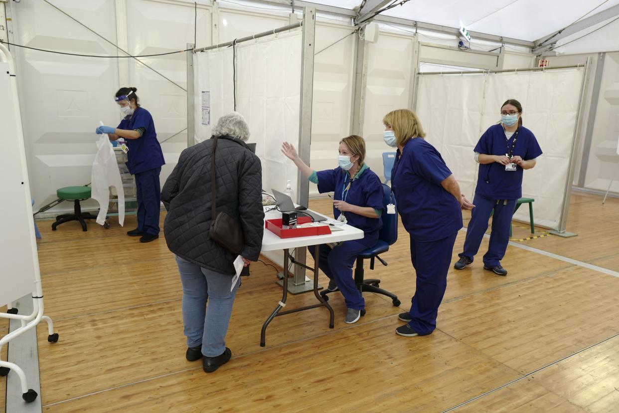 NHS staff during the AstraZeneca/Oxford COVID-19 vaccination program on Feb. 1, 2021, in the vaccination center at the Royal Cornwall Showground in Wadebridge, England.