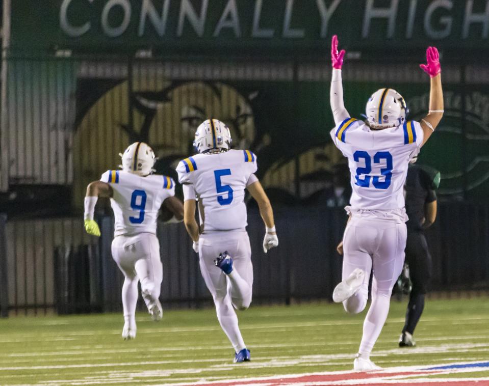 Pflugerville linebacker Brandon Bradshaw, left, returns an intercepted pitch play in overtime 80 yards in overtime, lifting the Panthers into the state playoffs with a thrilling 44-38 win. "That was the biggest moment of my career, definitely," a jubilant Bradshaw said afterward.