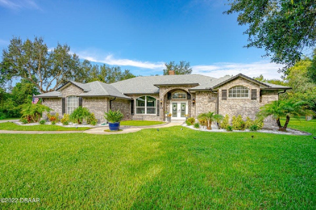 This stunning pool home is perfectly placed on over an acre in the heart of Port Orange, with no HOA.