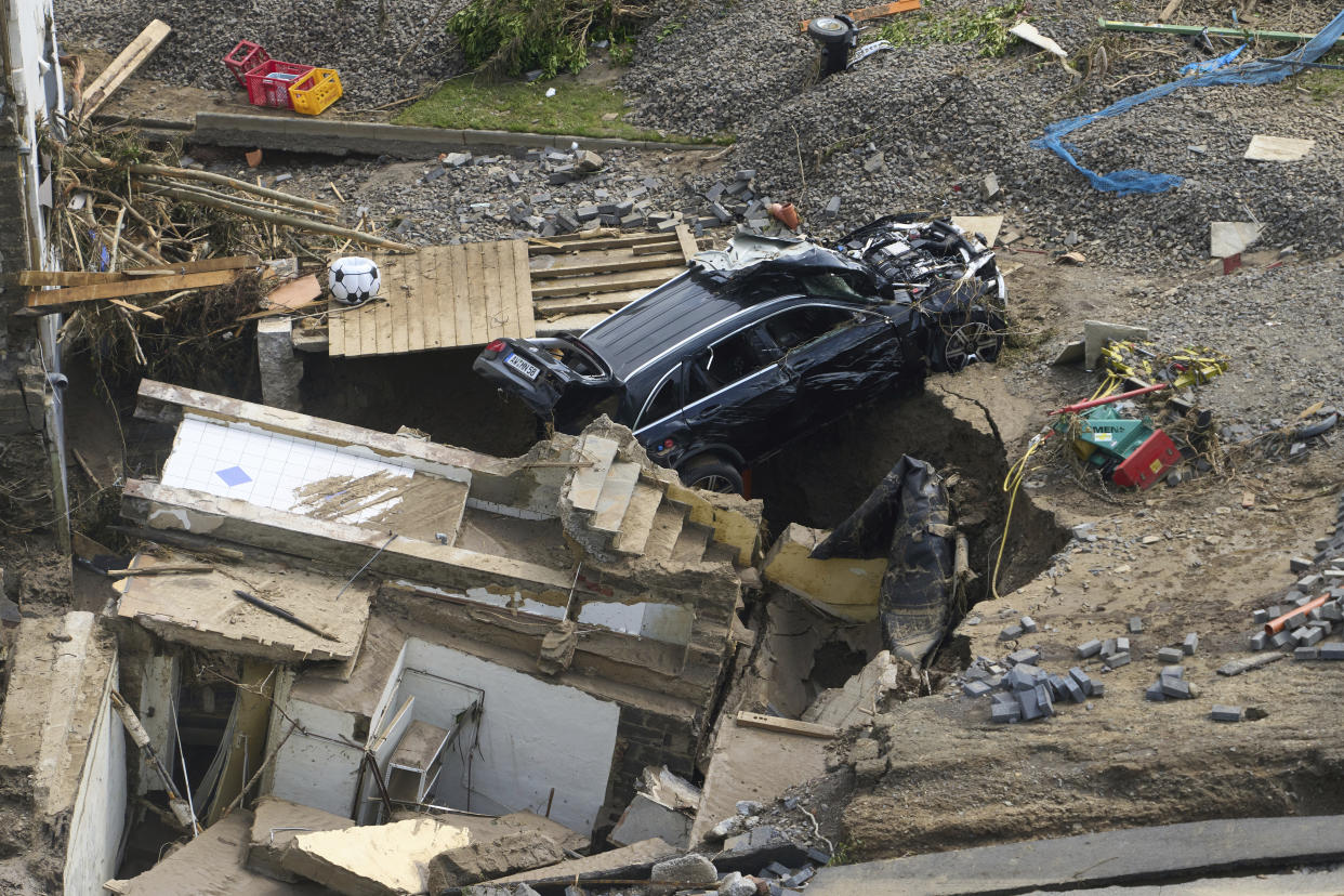 Houses and cars in the Ahr valley in the Walporzheim district are destroyed in Bad Neuenahr-Ahrweiler, Germany, Saturday, July 17, 2021. Clean-up work begins in the areas affected by the storm. Days of heavy rain in Western Europe turned normally minor rivers and streets into raging torrents this week and caused the disastrous flooding that swept away cars, engulfed homes and trapped residents. (Thomas Frey/dpa via AP)