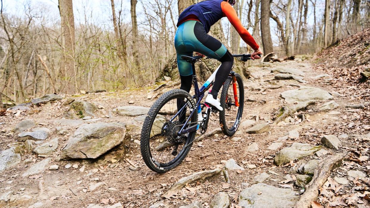 a person riding a bike on a rocky trail