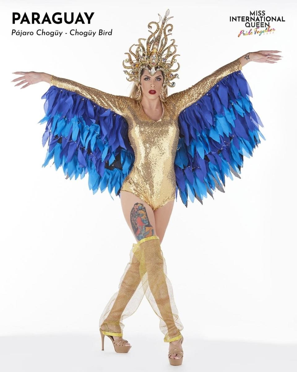 Miss Paraguay in a gold bodysuit and blue wings