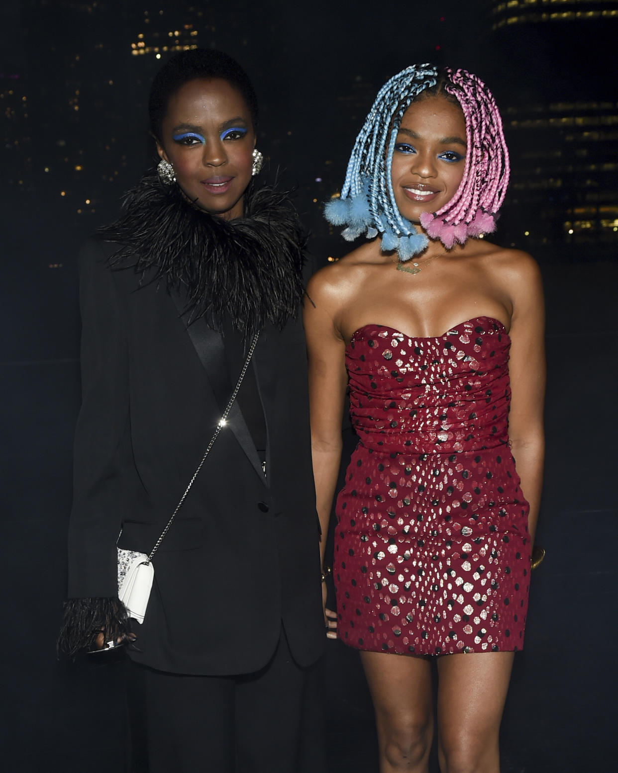 Singer Lauryn Hill, left, and daughter Selah Marley attend the Saint Laurent Spring/Summer 2019 Menswear Collection at Liberty State Park on Wednesday, June 6, 2018, in New Jersey. (Photo by Evan Agostini/Invision/AP)