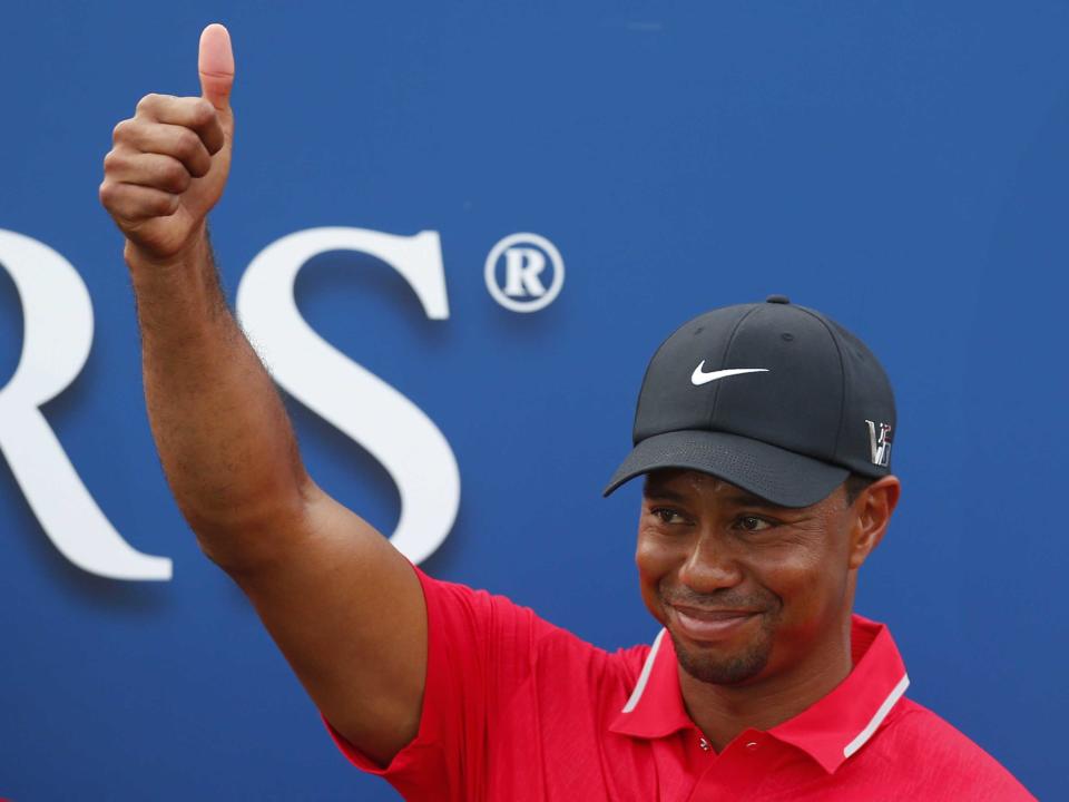 Tiger Woods thumbs up happy patriotic