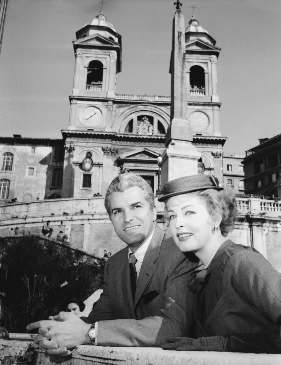 <p>Two years after their 1954 nuptials, these two performers finally went on their honeymoon. Here, they pose outside the Church of Trinità dei Monti in Rome. </p>