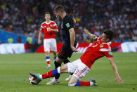 <p>Ante Rebic is tackled by Russia’s Ilya Kutepov </p>