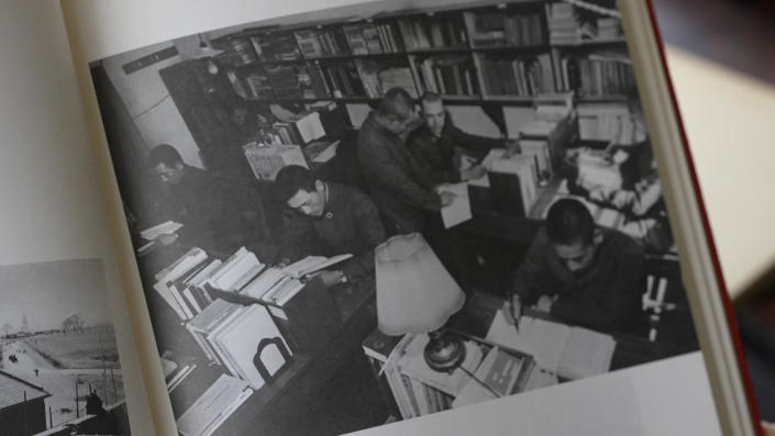 A photo album displayed in Toyokawa, Aichi prefecture, Japan, on Sept. 16, 2022, shows students studying at a library at Kenkoku University in Manchuria, northern China. Kenkoku University was established in northern China in 1938 as a grand piece of imperial propaganda meant to celebrate Japan's prewar colonization of large swaths of Asia, but in recent years, the dwindling number of surviving students, their families and those who have researched its history have come to share a sense of cross-national unity. (Kenkoku University via AP)