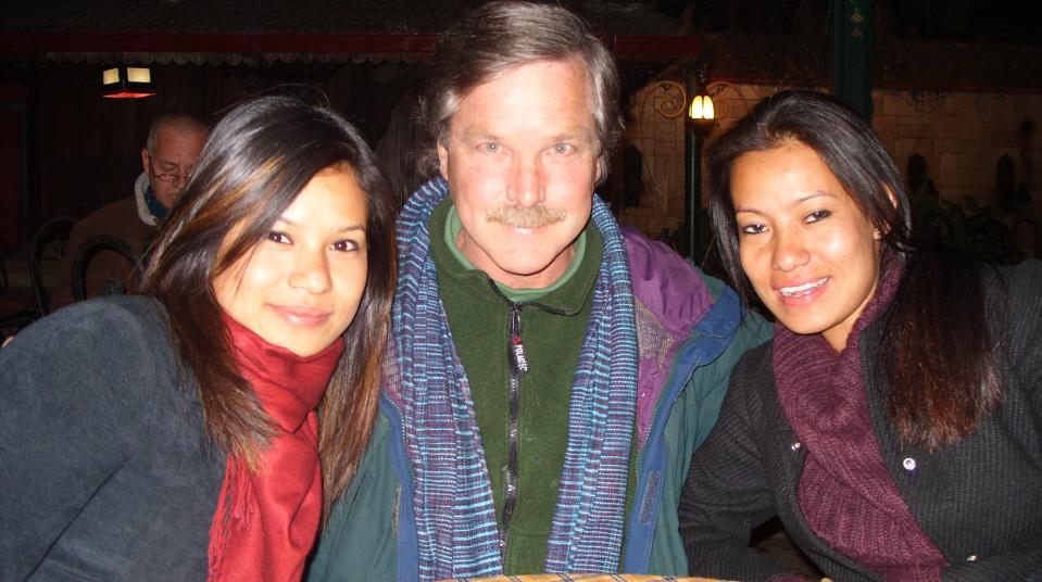 Dan Donaghue poses with his Nepalese goddaughters in Kathmandu, the capital of Nepal.