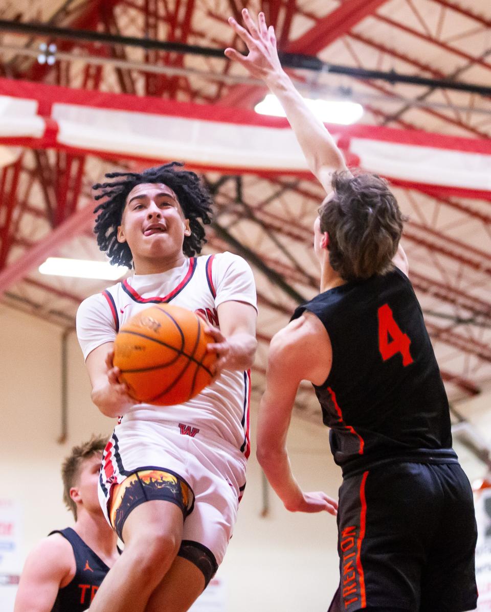 Williston Red Devils guard Aramys Rodriguez (1) drives to the basket in the second half. Williston High School hosted Trenton High School in the boys basketball Class 1A-Region 4 Final at Williston High School, Tuesday night, February 20, 2024. Williston defeated Trenton 95-37 and advanced to the final four in Lakeland, Fla. [Doug Engle/Ocala Star Banner]2024