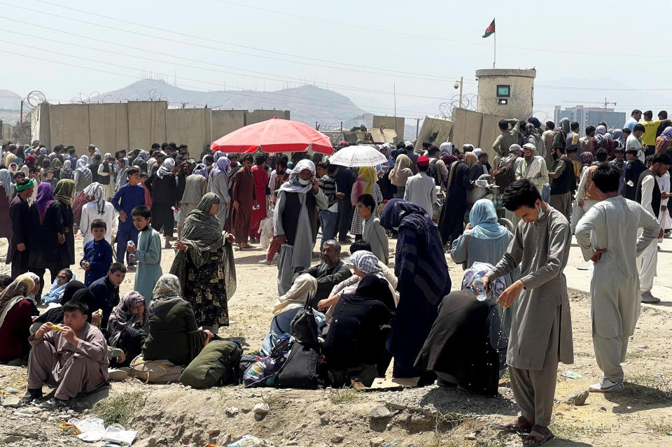 People wait outside Hamid Karzai International Airport in Kabul, Afghanistan, on Aug. 17, 2021. (Reuters)