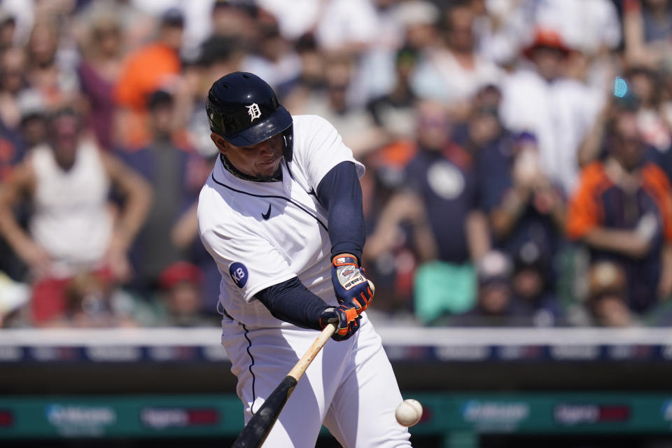 Detroit Tigers designated hitter Miguel Cabrera connects for a single during the sixth inning of the first baseball game of a doubleheader against the Colorado Rockies, Saturday, April 23, 2022, in Detroit. (AP Photo/Carlos Osorio)