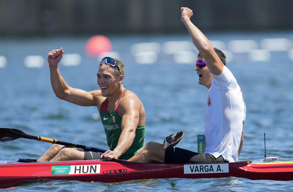 Balint Kopasz, left, and Adam Varga,, of Hungary react after finishing first and second respectively in the men's kayak single 1000m final at the 2020 Summer Olympics, Tuesday, Aug. 3, 2021, in Tokyo, Japan. (AP Photo/Lee Jin-man)