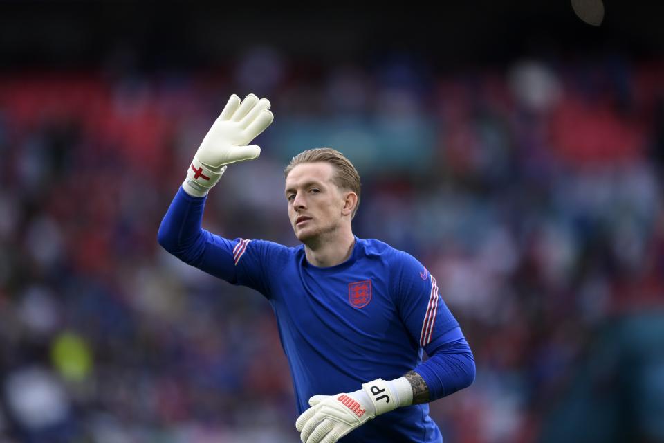 England's goalkeeper Jordan Pickford waves to the fans before the Euro 2020 soccer final match between England and Italy at Wembley stadium in London, Sunday, July 11, 2021. (Laurence Griffiths/Pool via AP)