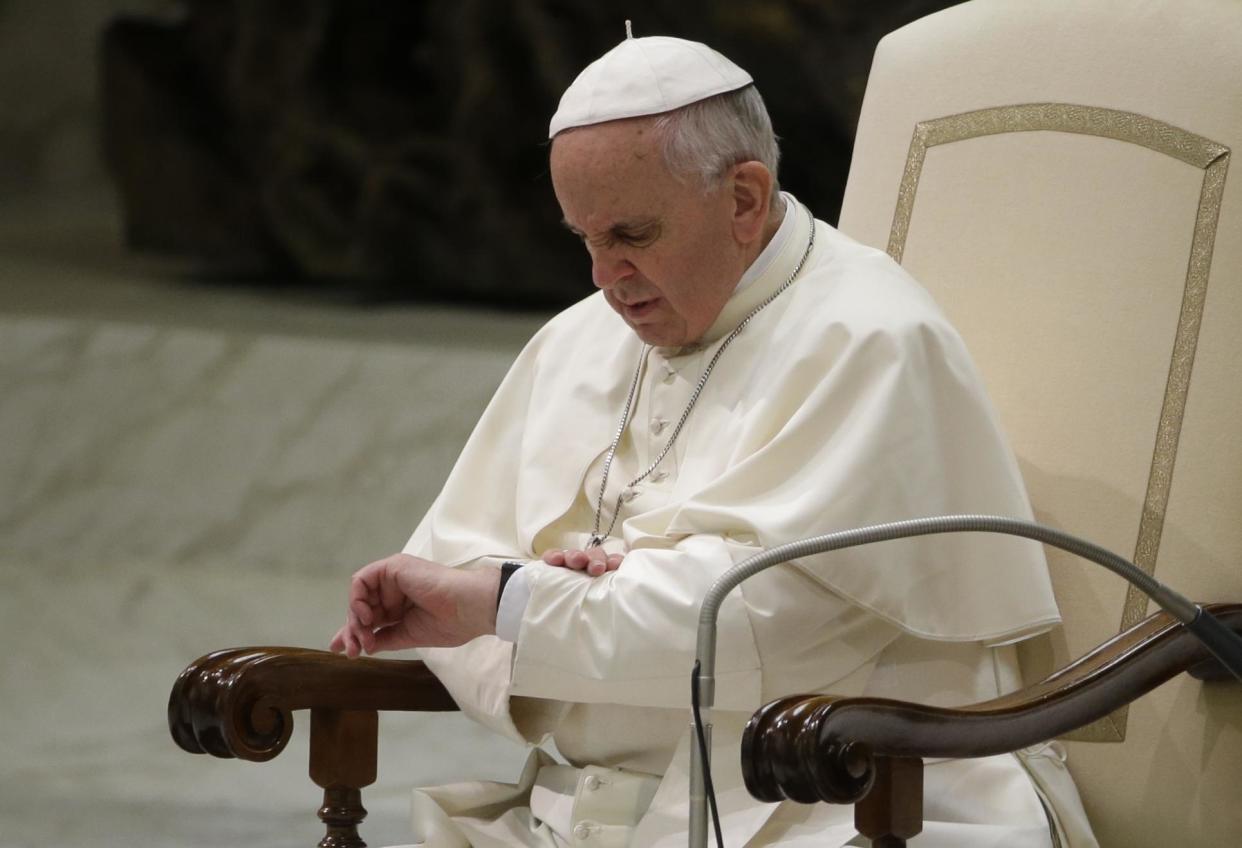 Pope Francis checking his watch