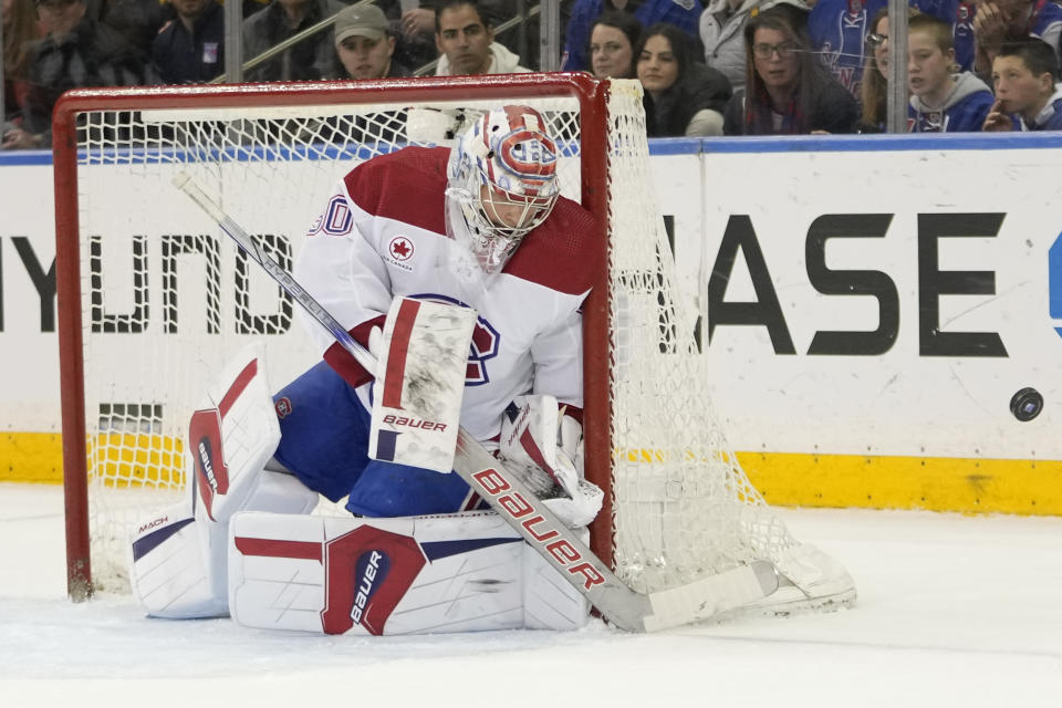 Montreal Canadiens goaltender Cayden Primeau makes a save against the New York Rangers during the first period of an NHL hockey game, Sunday, April 7, 2024, at Madison Square Garden in New York. (AP Photo/Mary Altaffer)