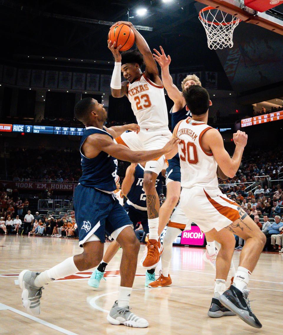 Texas forward Dillon Mitchell pulls down a rebound Wednesday. Mitchell had a career-high 13 boards.