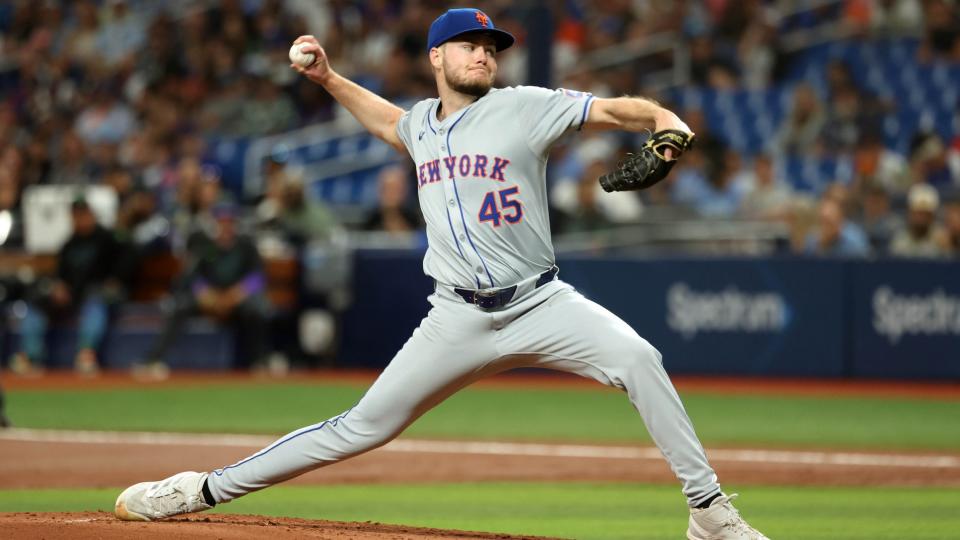 May 4, 2024; St. Petersburg, Florida, USA; New York Mets starting pitcher Christian Scott (45) throws a pitch against the Tampa Bay Rays during the first inning at Tropicana Field.