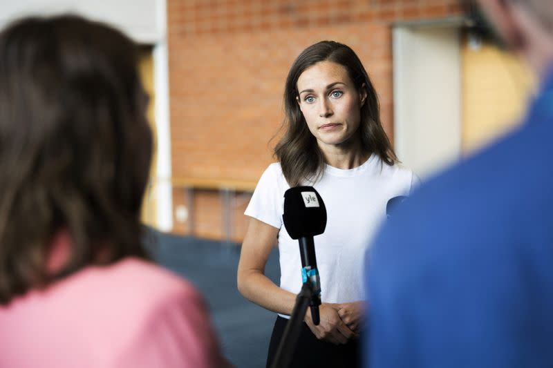 Finland's Prime Minister Sanna Marin speaks with members of the media in Kuopio