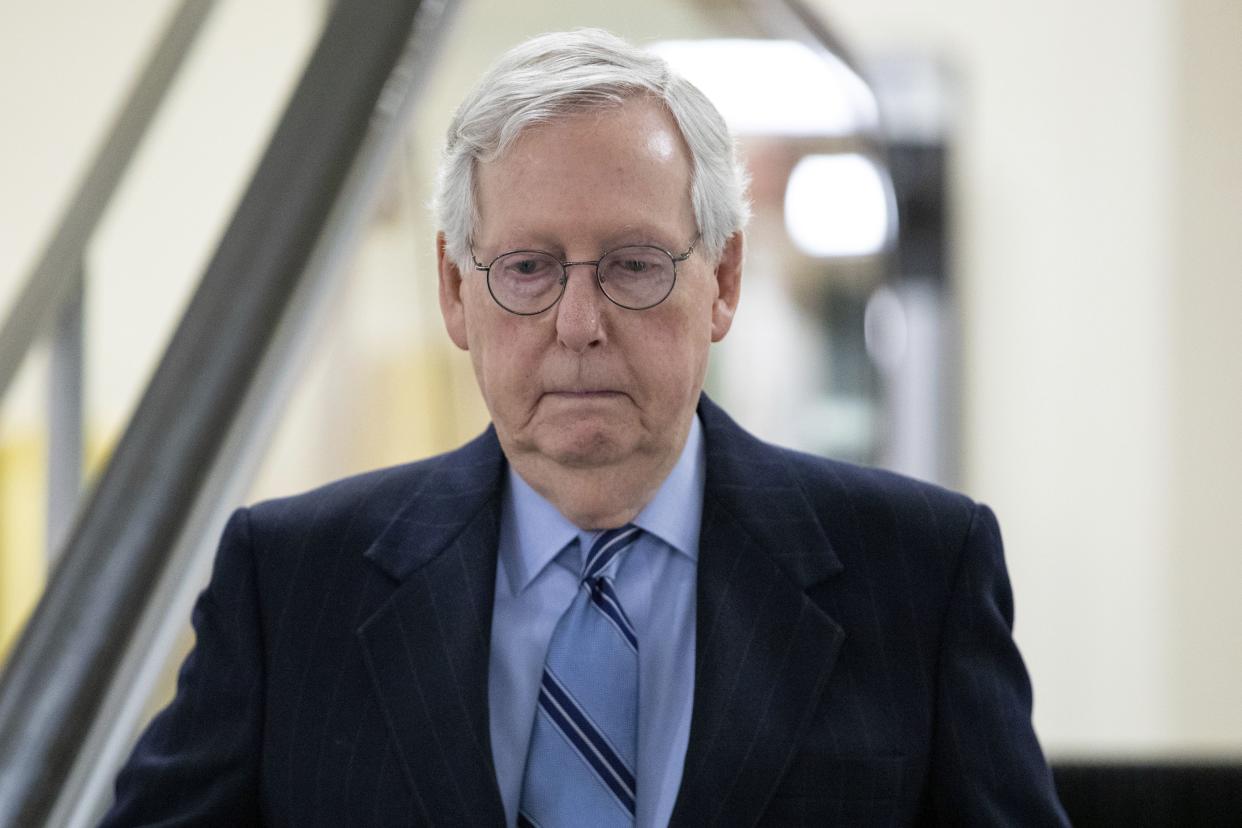 Senate Minority Leader Mitch McConnell (R-Ky.) goes down an escalator at the Capitol in Washington, D.C. on Wednesday, Jan. 19, 2022.