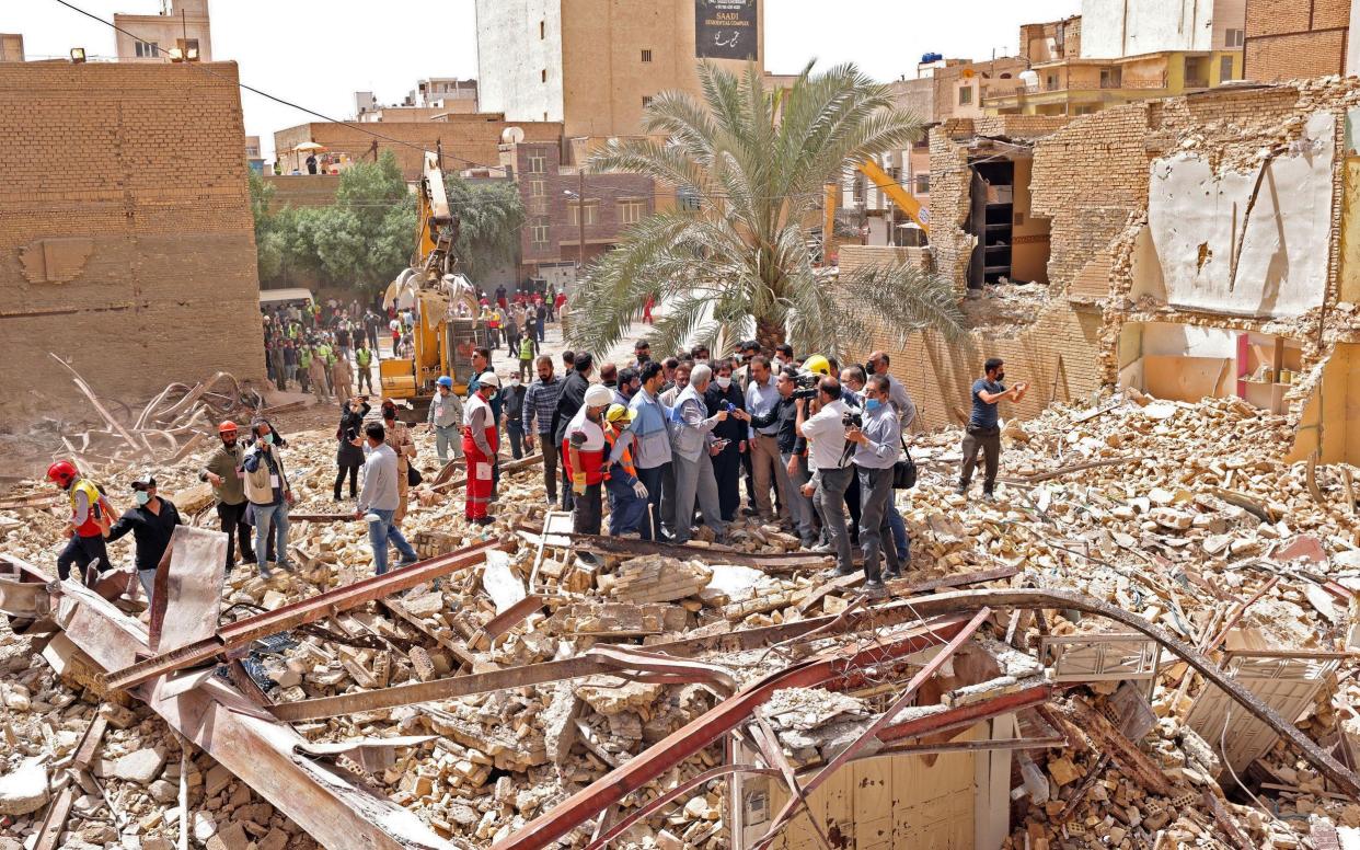 Mohammad Mokhber, Iran's vice-president, visits the site where the Metropol building collapsed, killing at least 28 people - Iranian Presidency/AFP via Getty Images