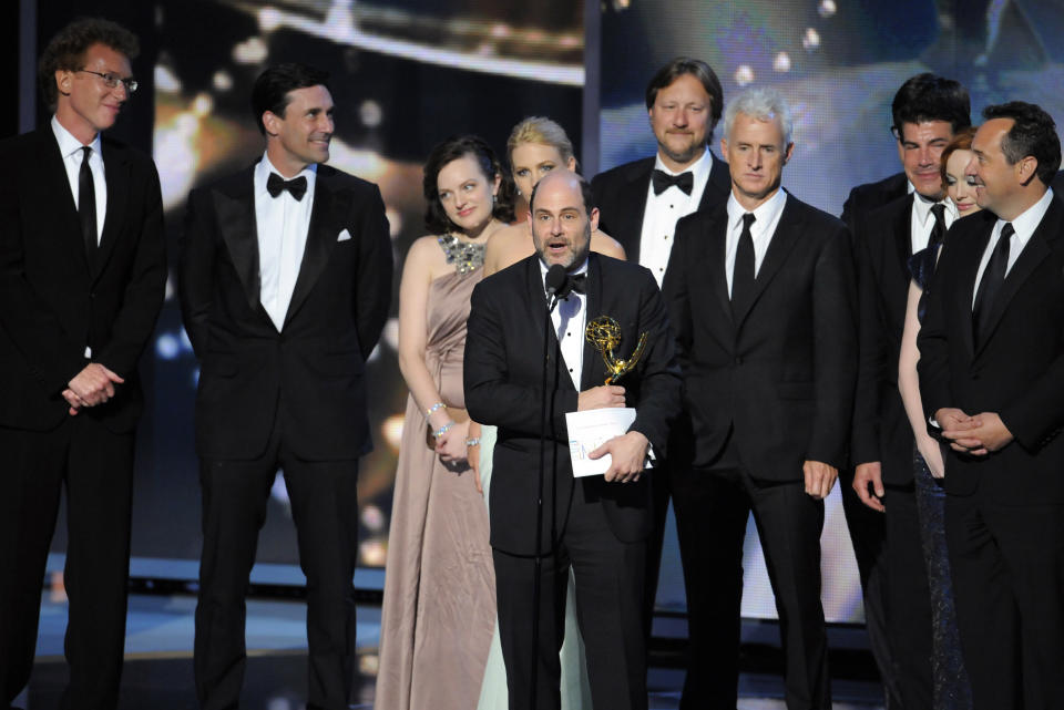 FILE - Matthew Weiner, creator of "Mad Men," stands among cast and crew members as he accepts the award for best drama series at the 61st Primetime Emmy Awards in Los Angeles on Sept. 20, 2009. (AP Photos/Mark J. Terrill, File)