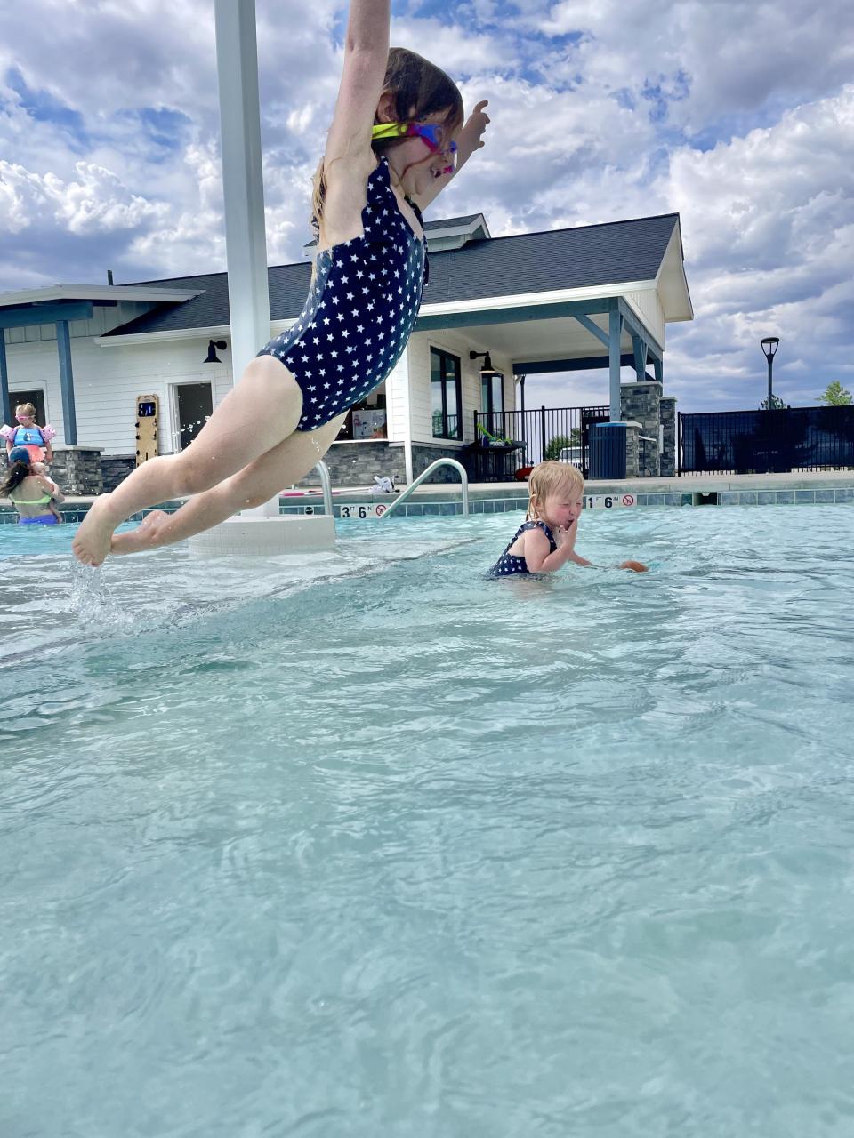 author's daughters at the pool