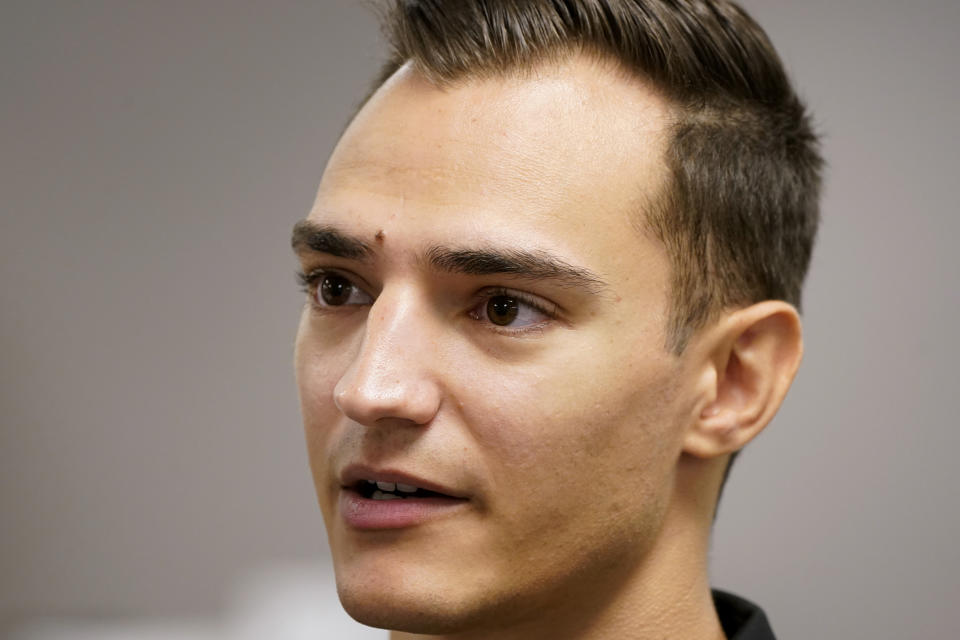 Alex Palou, of Spain, speaks to the media before an IndyCar Series auto race practice, Friday, July 22, 2022, at Iowa Speedway in Newton, Iowa. The Iowa-based supermarket chain Hy-Vee has pumped at least $10 million into the weekend, which features two IndyCar races and a slew of celebrity concerts. (AP Photo/Charlie Neibergall)