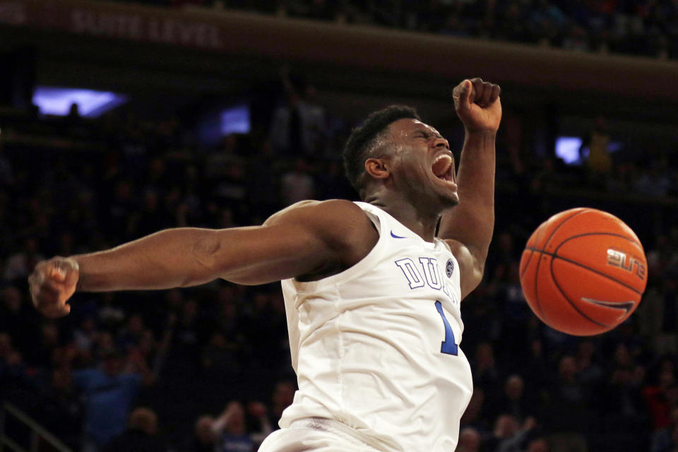 FILE - In this Dec. 20, 2018, file photo, Duke forward Zion Williamson (1) reacts after a dunk against Texas Tech during the first half of an NCAA college basketball game, in New York. Duke freshman Zion Williamson is both The Associated Press player and newcomer of the year in the Atlantic Coast Conference, Tuesday, March 12, 2019.(AP Photo/Adam Hunger, File)