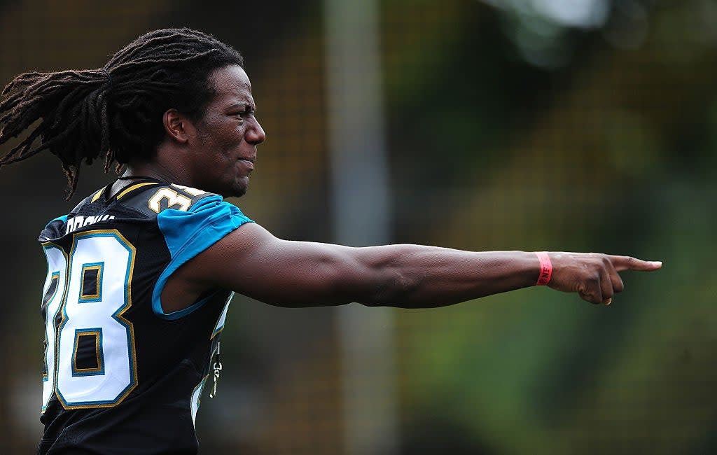 Sergio Brown of the Jacksonville Jaguars helps to coach a team of local school children during the NFL Launch of the Play 60 scheme at the Black Prince Community Hub on July 15, 2015 in London, England. (Getty Images)