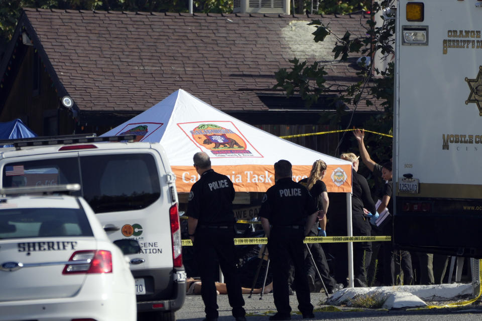 Law enforcement personnel stage at the scene of a mass shooting at Cook's Corner, Thursday, Aug. 24, 2023, in Trabuco Canyon, Calif. (AP Photo/Jae C. Hong)