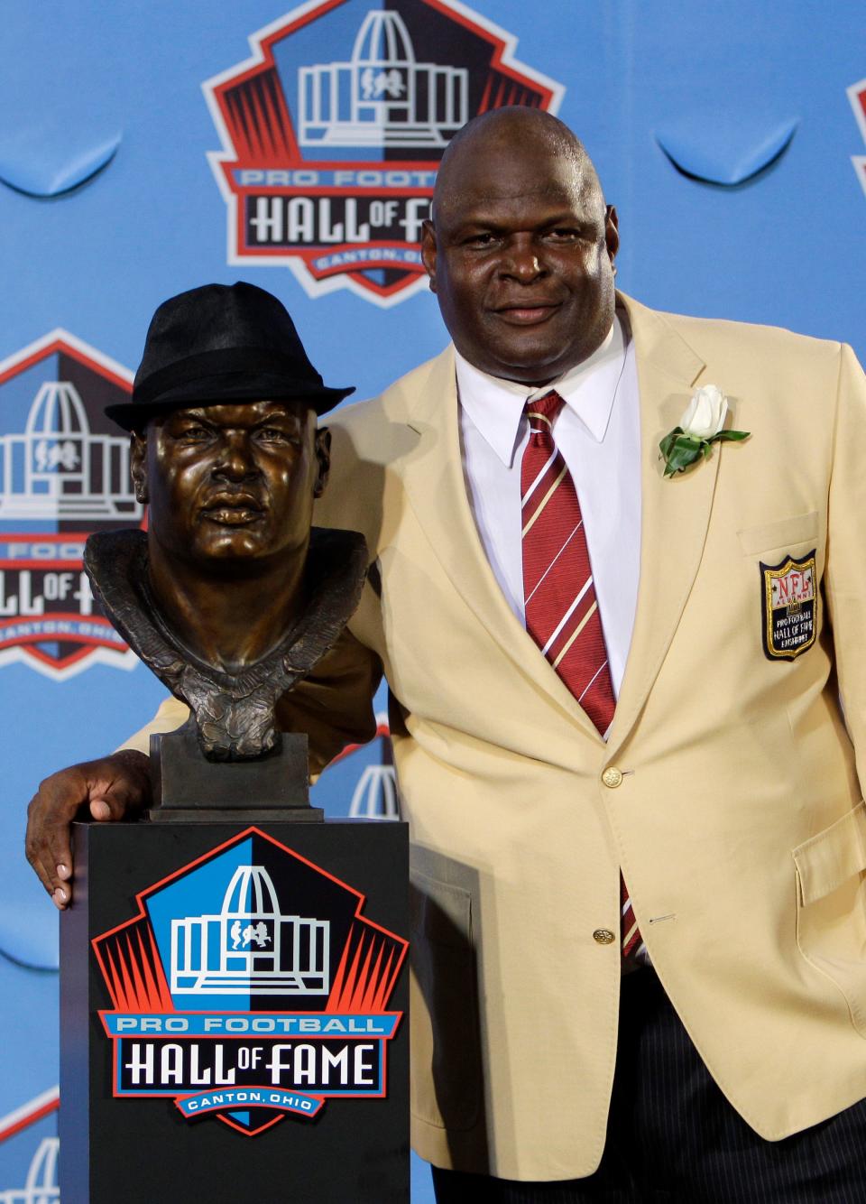 Former New Orleans Saints player Rickey Jackson poses with a bust of himself after enshrinement in the Pro Football Hall of Fame in Canton, Ohio, Saturday, Aug. 7, 2010. (AP Photo/Mark Duncan)