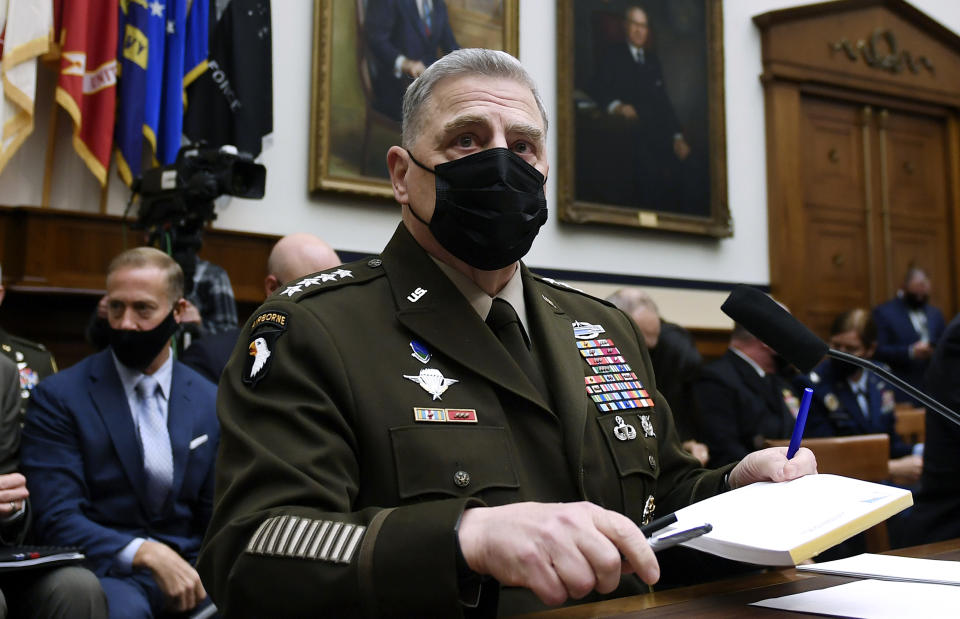 FILE - Gen. Mark Milley, chairman of the Joint Chiefs of Staff, arrives to testify before the House Armed Services Committee on the conclusion of military operations in Afghanistan, Sept. 29, 2021, on Capitol Hill in Washington. Milley has tested positive for COVID-19 and is experiencing very minor symptoms, a spokesperson said Monday. (Olivier Douliery/Pool via AP, File)