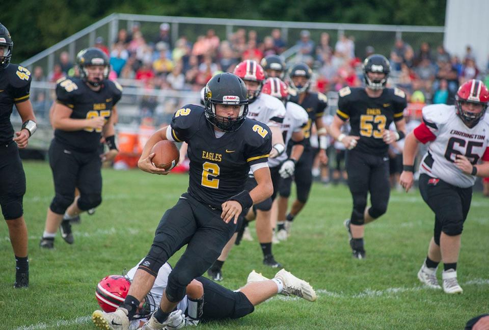 Colonel Crawford's Kam Lohr slips past a Cardington defender for a big gain.