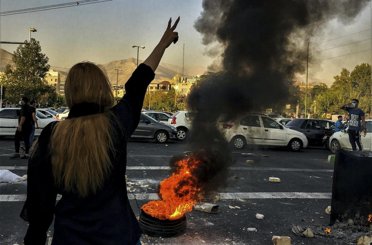 Iranian woman protest the death of Mahsa Amini. She died after she was detained by the morality police in Tehran in September 2022. This photo was taken by an individual not employed by the Associated Press and obtained by the AP outside Iran. (AP Photo/Middle East Images)