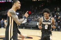 Atlanta Hawks forward John Collins (20) and guard Brandon Goodwin (0) celebrate after a 102-95 victory in an NBA basketball game against the Los Angeles Clippers, Wednesday, Jan. 22, 2020, in Atlanta. (AP Photo/Brett Davis)