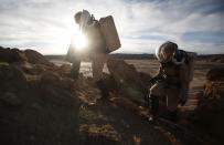 ��Melissa Battler (L), a geologist and commander of the Crew 125 EuroMoonMars B mission, and Csilla Orgel, a geologist, climb a rock formation to collect geologic samples for study at the Mars Desert Research Station (MDRS) in the Utah desert March 2, 2013. The MDRS aims to investigate the feasibility of a human exploration of Mars and uses the Utah desert's Mars-like terrain to simulate working conditions on the red planet. Scientists, students and enthusiasts work together developing field tactics and studying the terrain. All outdoor exploration is done wearing simulated spacesuits and carrying air supply packs and crews live together in a small communication base with limited amounts of electricity, food, oxygen and water. Everything needed to survive must be produced, fixed and replaced on site. Picture taken March 2, 2013. REUTERS/Jim Urquhart