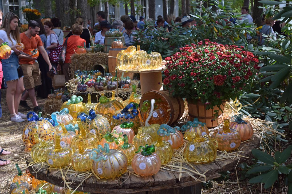 The glass pumpkin patch is shown at the WheatonArts Festival of Fine Craft.