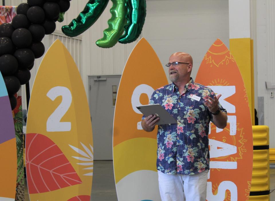 Daniel Flowers, president and CEO of the Akron-Canton Regional Foodbank, addresses attendees at Friday's open house celebration at the agency's Canton warehouse.