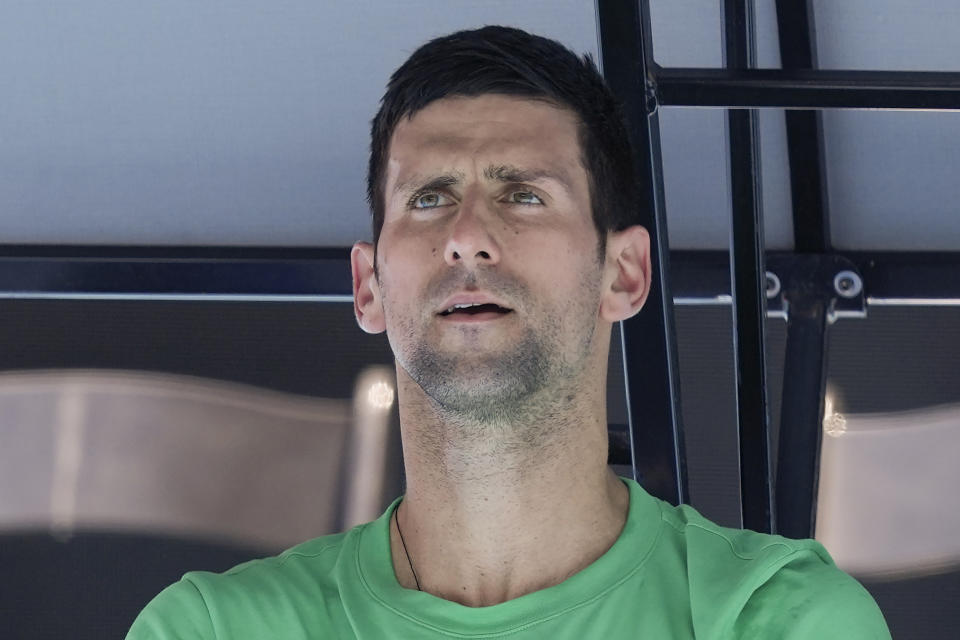 FILE - Defending men's champion Serbia's Novak Djokovic rests during a practice session on Margaret Court Arena ahead of the Australian Open tennis championship in Melbourne, Australia on Jan. 13, 2022. Djokovic, who is unvaccinated against the coronavirus, faces deportation from Australia after Immigration Minister Alex Hawke on Friday, Jan. 14, 2022 revoked his visa for the second time, citing health and good order considerations. (AP Photo/Mark Baker, File)