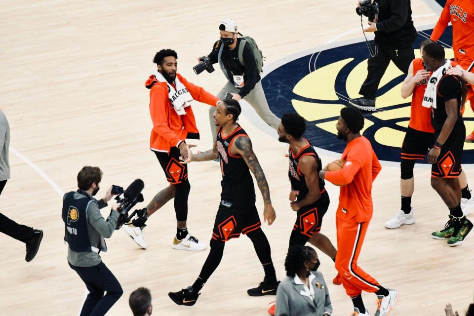 Bulls star DeMar DeRozan, center, walks off the court after draining a game-winning 3 against the Pacers at Gainbridge Fieldhouse in Indianapolis on Dec. 31, 2021.
