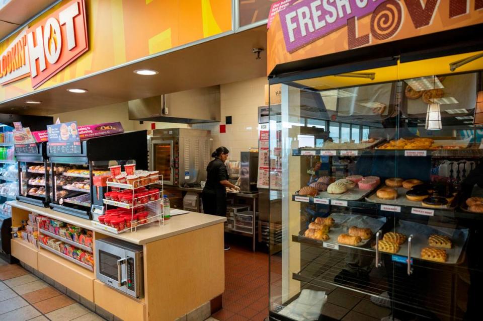 A worker makes fresh food at Arco gas station April 7, 2023, at the Sacramento International Airport. The convenience store has two full-time cooks to meet the demands of customers seeking sandwiches or pastries.