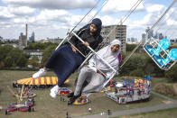 <p>Children enjoy a ride during an Eid in the Park celebration marking the start of Eid Al-Adha at Burgess Park on August 21, 2018 in London, England. The traditional four-day celebratory festival marks one of the holiest days in the Islamic religious calendar. (Photo by Dan Kitwood/Getty Images) </p>